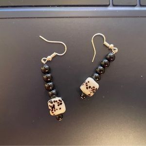 White spotted dangle earrings.